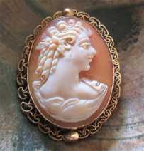 Mariska Veres “Shocking Blue” - greatly carved/signed profile. Set in Gold Filled filigree brooch/pendant circa 1970.