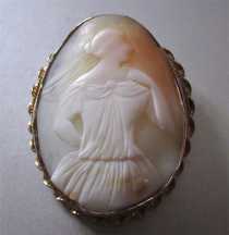 Sexy symbol from 1850-1870 hand carved Light Shell. Unmarked Gold/Gold plated twisted rope brooch.
