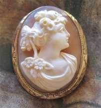 Greatly hand carved classic from 1910th - 1930th. Set in hallmarked Gold Filled brooch/pendant.