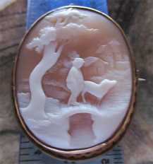 Hand carved detailing country landscape-boy & dog on the bridge Gold(?)/Gold plated(?) Brooch/Pendant. Circa 1880 shell.