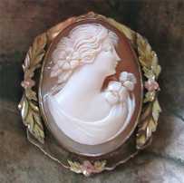 Superiorly hand carved/signed 1920th - 1930th. Shell set in Decorative Gold/Silver brooch.