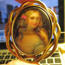 Hand painted Early Victorian portrait of pretty girl. Big Pinchbeck/Gold Filled(?) Brooch circa 1850.