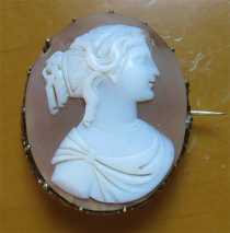 Female profile 1850-1870 hand carved Sardonyx Shell. Unmarked Gold(?)/Gold plated long pin brooch.