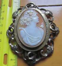 Female profile (Flora?) circa 1910th hand carved detailing shell. Huge Unmarked Gold(?)/Gold plated brooch circa 1870.