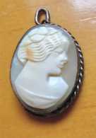Hand carved/signed shell circa 1910th - 1930th. Unmarked Gold washed w/patina pendant.