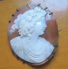 Superiorly hand carved Bacchante(?) 1850th - 1880th. Early Victorian shell set in Pinchbeck(?) brooch.