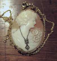 Quality hand carved circa 1920-1930 Beauty with diamonds shell Unmarked/tested 14K Gold Rolled pendant with 18” chain.