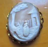 Hand carved Antique shell - Woman in the country landscape Gold Filled twisted rope Victorian Brooch. Circa 1860-1880.