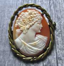 Best Quality carved/signed Art Deco Muse shell from US collection. Embedded in unmarked Gold plated brooch circa 1920th.