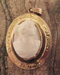 Edwardian, circa 1905 high relief carved coral image Roman women. Unmarked Gold or Gold filled etched ornament Pendant.