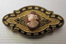Georgian circa 1920 carved shell & Greek ornament. Gold washed & black glaze on bronze Brooch.