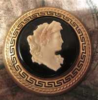 Georgian circa 1920 woman profile in Greek ornament. Gold washed & black glaze in the big circle bronze Brooch.