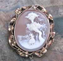 Greatly carved Victorian high relief landscape woman at the tree shell Tested 10K Yellow Gold decorated frame Brooch/Pendant circa 1870