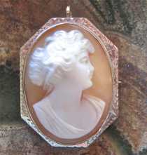 Quality hand carved shell profile from 1925-1935. Signed. Hallmarked 10K White Gold Brooch/Pendant.