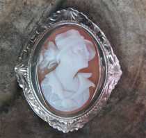 Remarkably carved girlish profile shell from 1925-1935. Etched design hallmarked 10K White Gold Brooch.