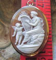Venus playing harp to Cupped - Museum Quality carved shell Big marked 14K Yellow Gold brooch/pendant circa 1890.
