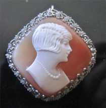 Stylish hand carved shell profile lady from 1925-1930. Filigree 10K White Gold US Brooch/Pendant.