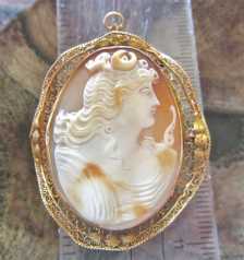 Quality Victorian/Edwardian hand carved shell from 1895-1915. Set in the tested 14K Yellow Gold Filigree Pendant/Brooch.