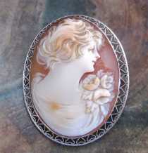 Quality hand carved shell profile from 1925-1935. Signed. Hallmarked 10K White Gold Filigree Brooch.