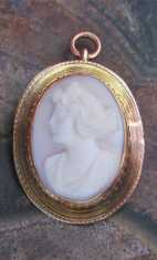 Tiny Greatly Carved Coral Stone Edwardian profile Classic Unmarked/Tested - 10K Yellow Gold pendant circa 1910 .