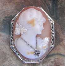 Quality hand carved shell girlish profile from 1925-1935. Hallmarked 14K White Gold Brooch/Pendant with diamond.