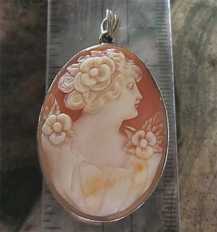Superiorly hand carved Art Nouveau shell circa 1915-1935 Unmarked/Tested 8K Gold Pendant. Signed by the Artist.