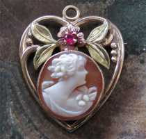 Quality hand carved shell girl from 1925-1930. Signed by Artist Marked 10K Yellow Gold heart sheped Brooch/Pendant w/ granate.