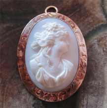 Edwardian Beauty - the hand carved Coral stone circa 1910 Marked/tested 10K Yellow Gold etched pendant/brooch.