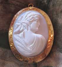 Hand carved Coral Ceres Motherhood/Fertility Goddess, circa 1910. Victorian/Edwardian hallmarked 10K Yellow Gold Brooch/Pendant.