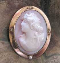 Carving high relief Coral/Angel Skin Diana Goddess circa 1905 Marked 10K Red Gold Late Victorian Brooch with pearls.
