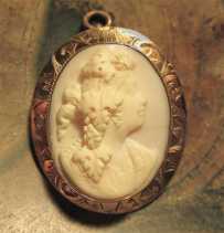 Hand carved Coral stone Bacchante priestess of Dionysus God. Tested 10K Yellow Gold Brooch/Pendant circa 1890 - 1915.