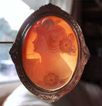 Remarkably carved girlish profile shell from 1925-1935. Etched design hallmarked 10K White Gold Brooch (L).