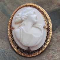 Hand carved Coral stone Ceres - Goddess of Motherhood. Hallmarked 10K Yellow Gold Brooch circa 1890 - 1915.