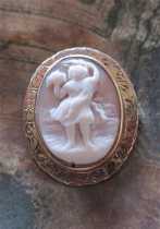 Hand carved naiad with a fish at see shore shell. Unmarked/tested 10K+ Yellow Gold Brooch circa 1870.