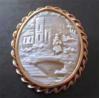 Well carved shell - landscape woman at the bridge & castle 10K Yellow Gold Victorian Brooch circa 1870-1890