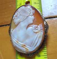 Hand carved shell profile of 1920th -1930th Beauty. Set in marked 10K+ Yellow Gold Brooch/Pendant