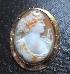Quality Multicolored hand carved Hunting Goddess Diana circa 1890 Hallmarked 10K Yellow Gold Victorian Huge brooch/pendant.
