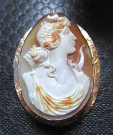 Hand carved Diana Goddess of Youth and Hunting, circa 1940. Post Edwardian hallmarked 10K Yellow Gold Brooch.