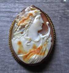 Hand carved Diana Goddess of Youth and Hunting shell, circa 1930. Museum Post Edwardian 10K Yellow Gold Brooch/Pendant.