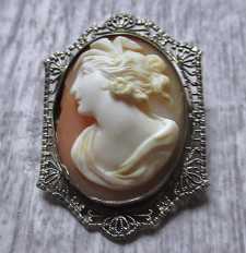 Well hand carved/signed shell Circa 1925 Ceres Goddess of Fertility Hallmarked filigree 10K White Gold Brooch (cheap on the left).