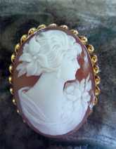 Beautifully carved marked 10K Yellow Gold Carnelian Shell Cameo Brooch Circa 1950. Signed by Artist