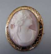 Angel Skin Coral portrait of Lady Marked 10K Yellow Gold etched bezel Cameo Brooch. Circa 1915