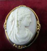 Museum Quality image of Greek woman Antique Coral Cameo brooch Marked 10K Gold clasp. Circa 1860