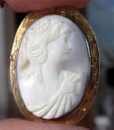 Coral portrait of Flora Goddess Marked 10K Yellow Gold etched bezel Cameo Brooch. Circa 1910