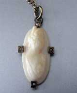 Marked 10K Yellow Gold Bezel Coral Cameo circa 1910 With Gold washed chain
