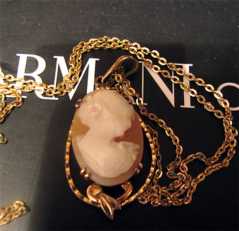 Marked 10K Yellow Gold Bezel Light Sardonyx Shell Cameo With Gold washed chain. Circa 1920