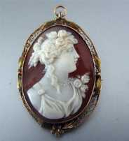 Superior Quality high relief image of woman in Sardonyx Shell Cameo Brooch/Pendant marked 10K Gold. Circa 1910