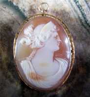 Circa 1895 Quality Carnelian Shell Roman woman portrait Brooch/Pendant marked 10K Gold. Signed
