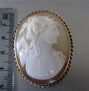 Circa 1910 Light Shell Brooch Marked (10K) Yellow Gold Diana-Goddess of Hunting