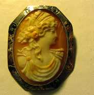 Circa 1890 Light Shell Brooch/Pendant Marked (10K) Yellow Gold Ceres - the Goddess of Agriculture. Few hairlines